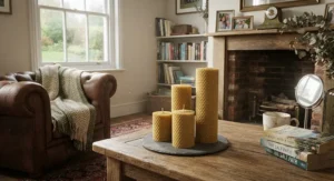 Artisan hand-rolled beeswax pillar candles displayed in a cosy British living room